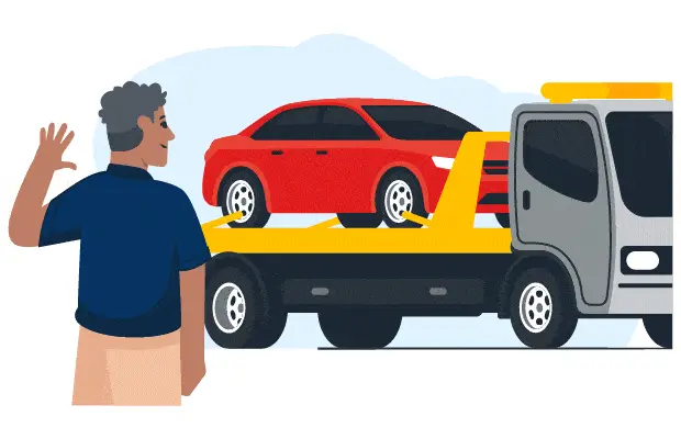 CarMax associate waves as car is hauled on a trailer to a car dealer
