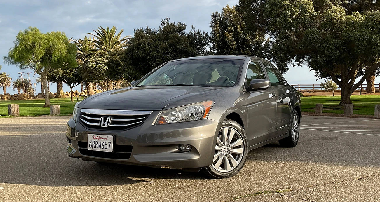 Front view of a gray eighth-generation Honda Accord sedan: 2008-2012 parked in parking lot
