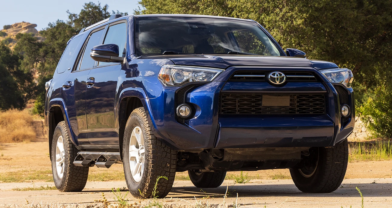 Blue Toyota 4Runner parked on offroad track 