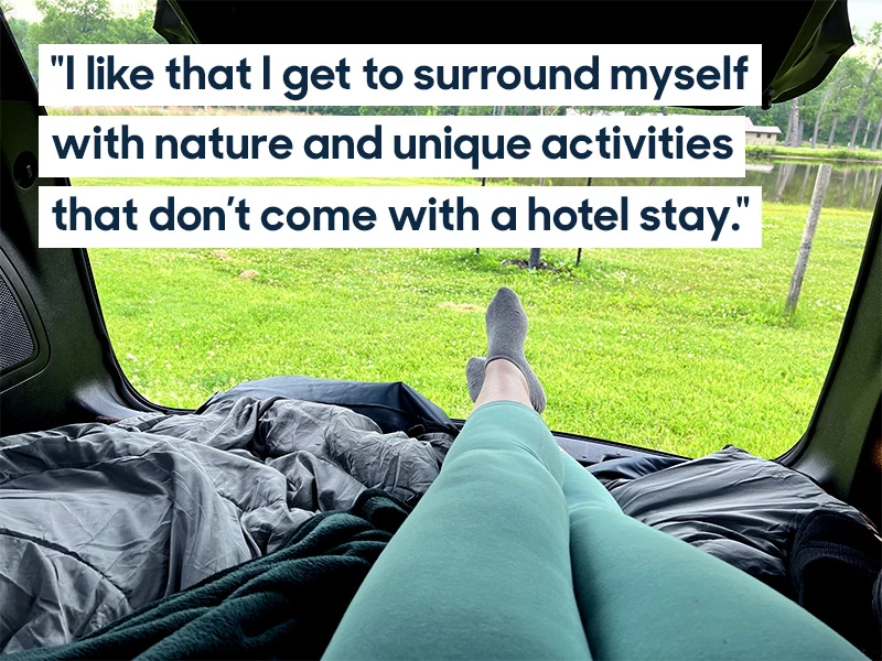 POV of person sitting in back of Ford Explorer SUV trunk is open with a view of a grassy lake area. Quote reads: "I like that I get to surround myself with nature and unique activities that come with a hotel stay". 