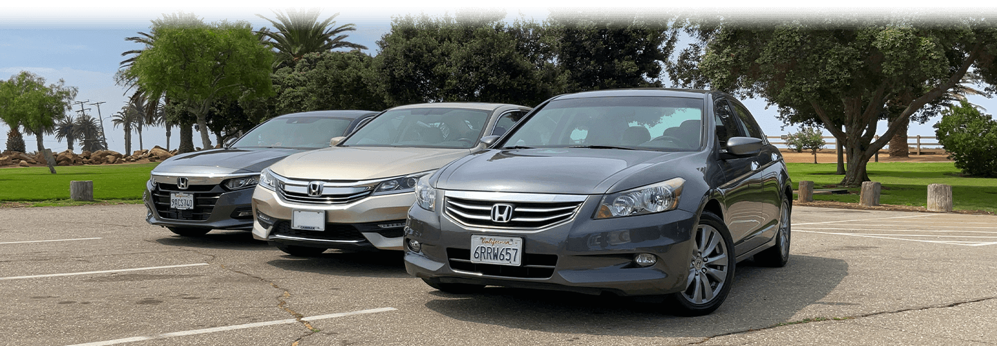 Three Honda Accord sedans parked next to one another in a parking lot.