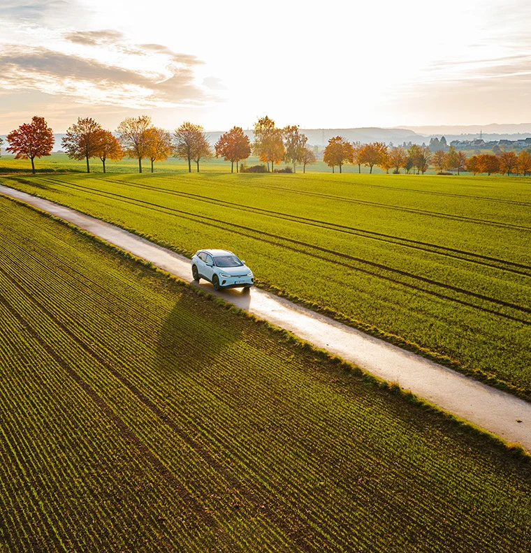 usage_05 | EV driving through a field during the Fall