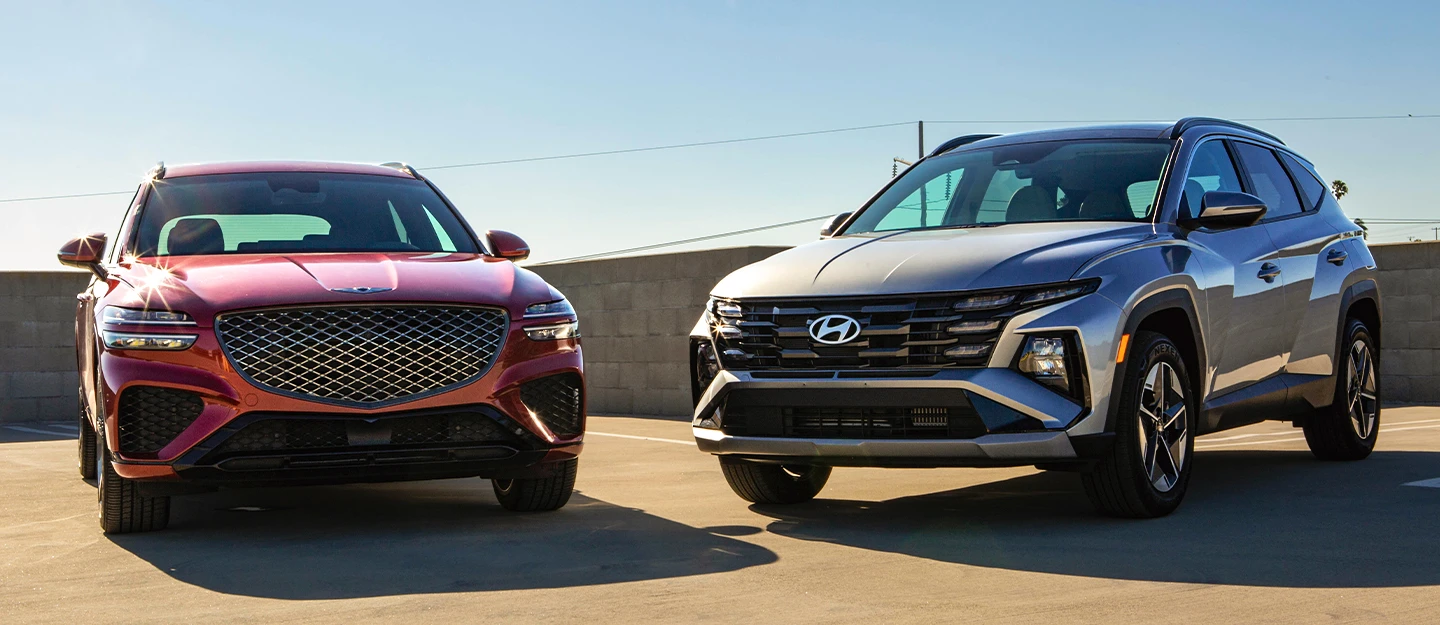 Side by side exterior Genesis GV70 and Hyundai Tucson