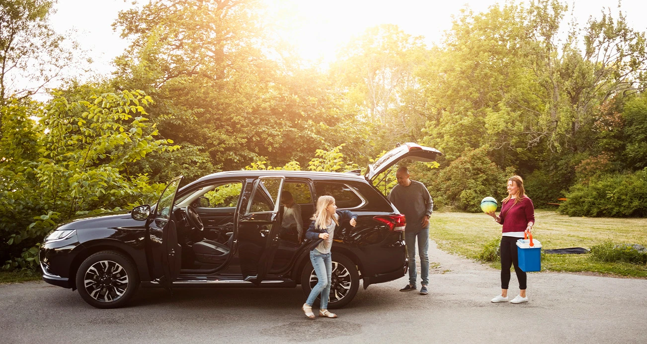 127 Best Used Cars for 2022: Family outside loading SUV | CarMax