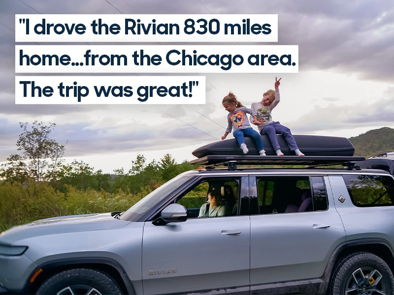 Two young girls pose atop the roof racks of a parked Rivian R1S while their mom sits in the passenger seat smiling. Quote overlaid on the image reads "I drove the Rivian 830 miles home ... from the Chicago area. The trip was great!"