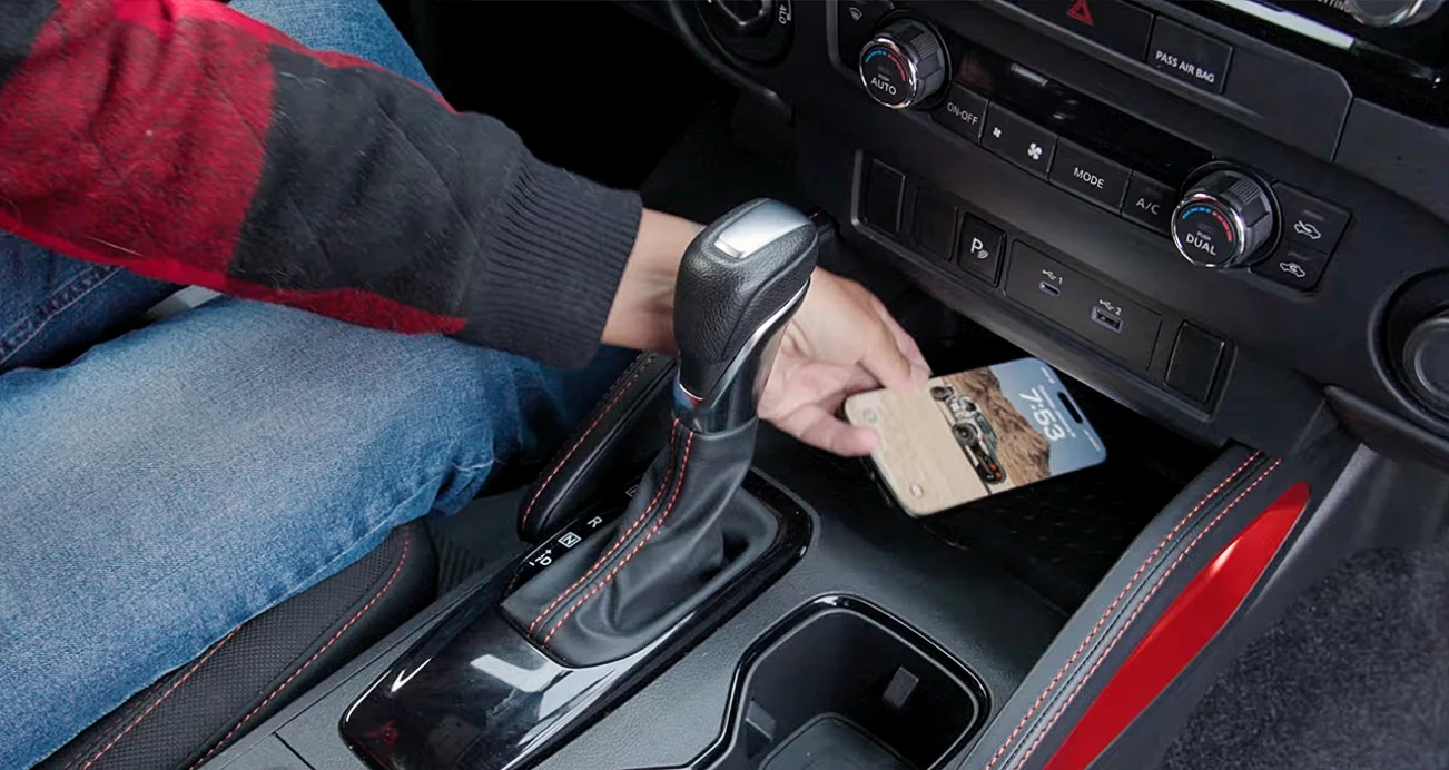 Hold placing cell on charging pad in car's console 